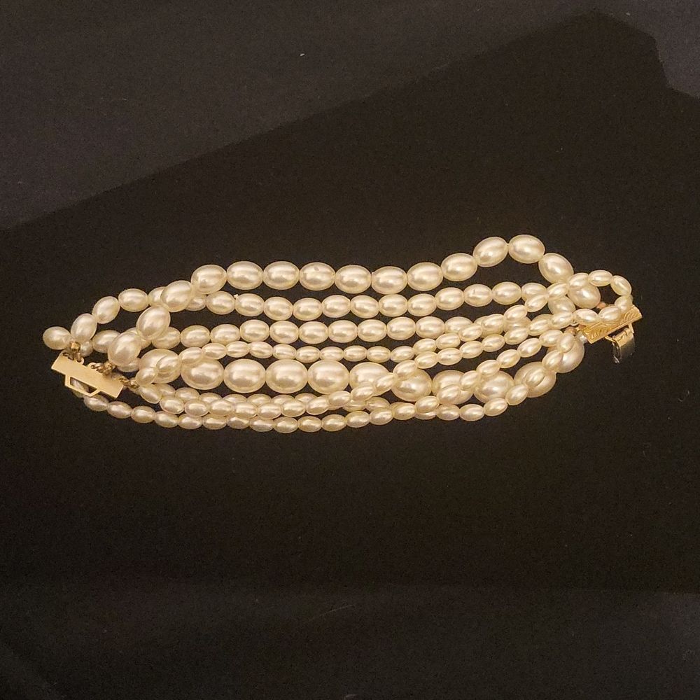 7 strand faux pearl statement bracelet with faux gold clasp- 8 in